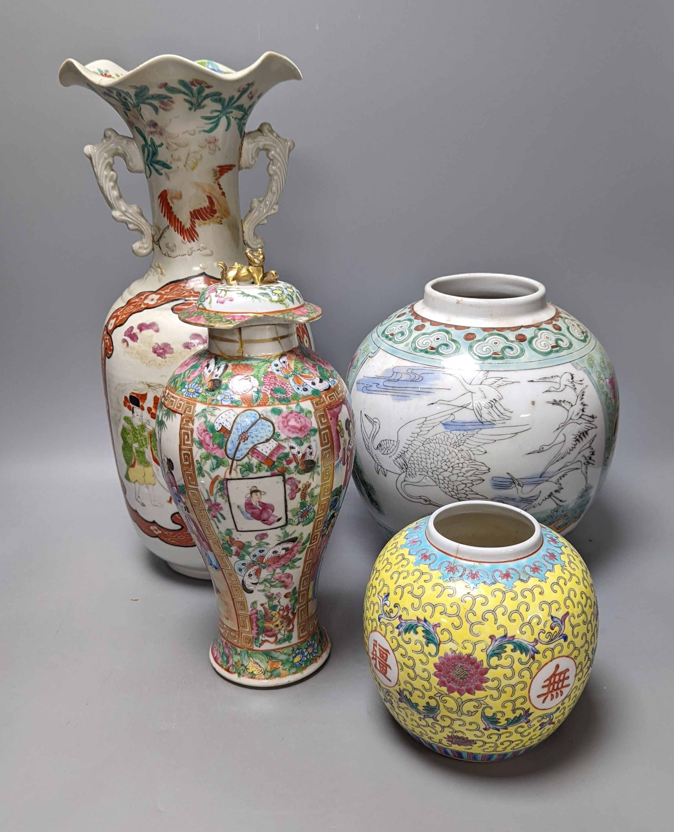 A Chinese famille rose vase and two ginger jars, together with a Japanese vase, 38cm